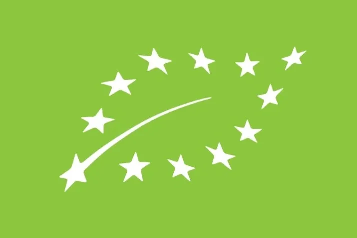 White stars forming leaf-shaped logo on green